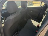 the back seat of a car with the door open and the driver ' s seat down