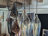 a chandelier made of glass hanging from the ceiling