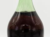 a bottle of liquid that is sitting on a table