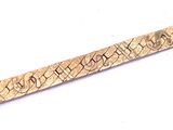 an image of a gold bracelet that has a design on it