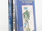 two books sitting on top of each other in front of a white background