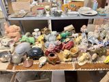 a table with many different types of pottery on it