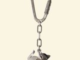 a keychain with an elephant on it that is attached to a chain