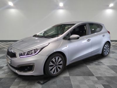 the silver car is parked on a checkered tile floor