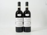 two bottles of wine sitting next to each other on a white surface