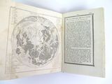 an open book with a map of the world on it