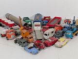 a lot of toy trucks that are sitting on the floor