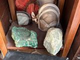 a small cabinet with a lot of items on it