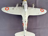 a model of a fighter plane on a gray surface