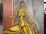 a painting of a woman sitting on an easel