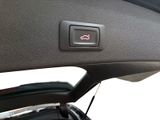 a close up of a button on a car ' s dashboard