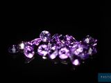 purple amethorate crystals on a black background