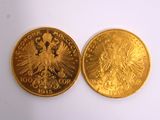 two pieces of gold coins, one of which is a double headed eagle and the other of which is a double headed eagle