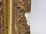 a picture of a gold frame that has been damaged