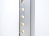 a metal object that is on a white surface