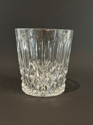 a glass cup that is sitting on a table