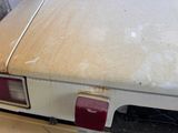 a dirty car that is parked in a garage