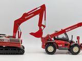 a red toy tractor and a red machine on a white background