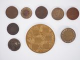 an assortment of coins including one penny, one penny, one penny, one penny, and one penny