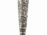 a silver spoon with a handle on a white background