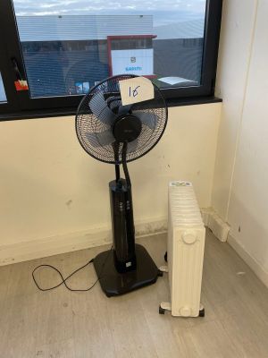 a fan sitting in front of a window in a room