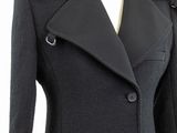 a close up of a black coat on a mannequin mannequin