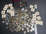 a lot of coins that are sitting on a table