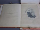 an open book with a picture of a man sitting on a chair