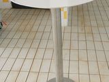 a white table with a tray on it in a kitchen