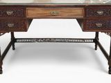 a wooden desk with a glass top and drawers