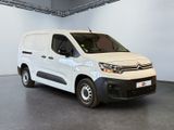 the white van is parked in the garage of a building