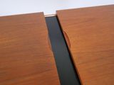 a close up of a wooden table with a black edge