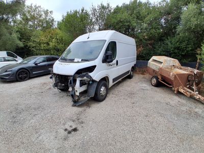 a white van that is parked in a parking lot