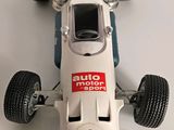 a model of a racing car on a white surface