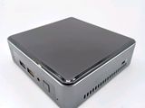 an image of a small computer sitting on top of a white surface