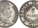 a silver coin with an image of a woman on it