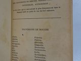 an old book opened to reveal a list of items on a table