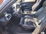 the interior of a car with a steering wheel and a dashboard