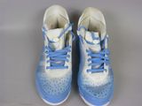 pair of blue and white running shoes with laces on them