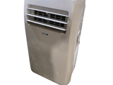 a small air conditioner sitting on top of a white table