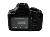 a digital camera that is sitting on a white surface