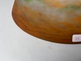 a brown vase with a green and yellow design on it