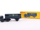 a toy truck with a box on the back of it