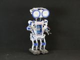 a robot that is standing on a black surface