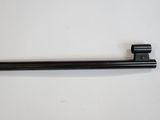 a close up of a black handle on a white surface