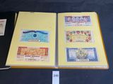 several different types of currency are on display in a book