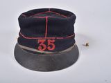 a black hat with a red number 35 on it