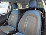 two seats in the back of a car with blue trims