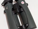 a close up of a pair of binoculars on a white surface