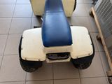 a scooter that is sitting on the floor in the room